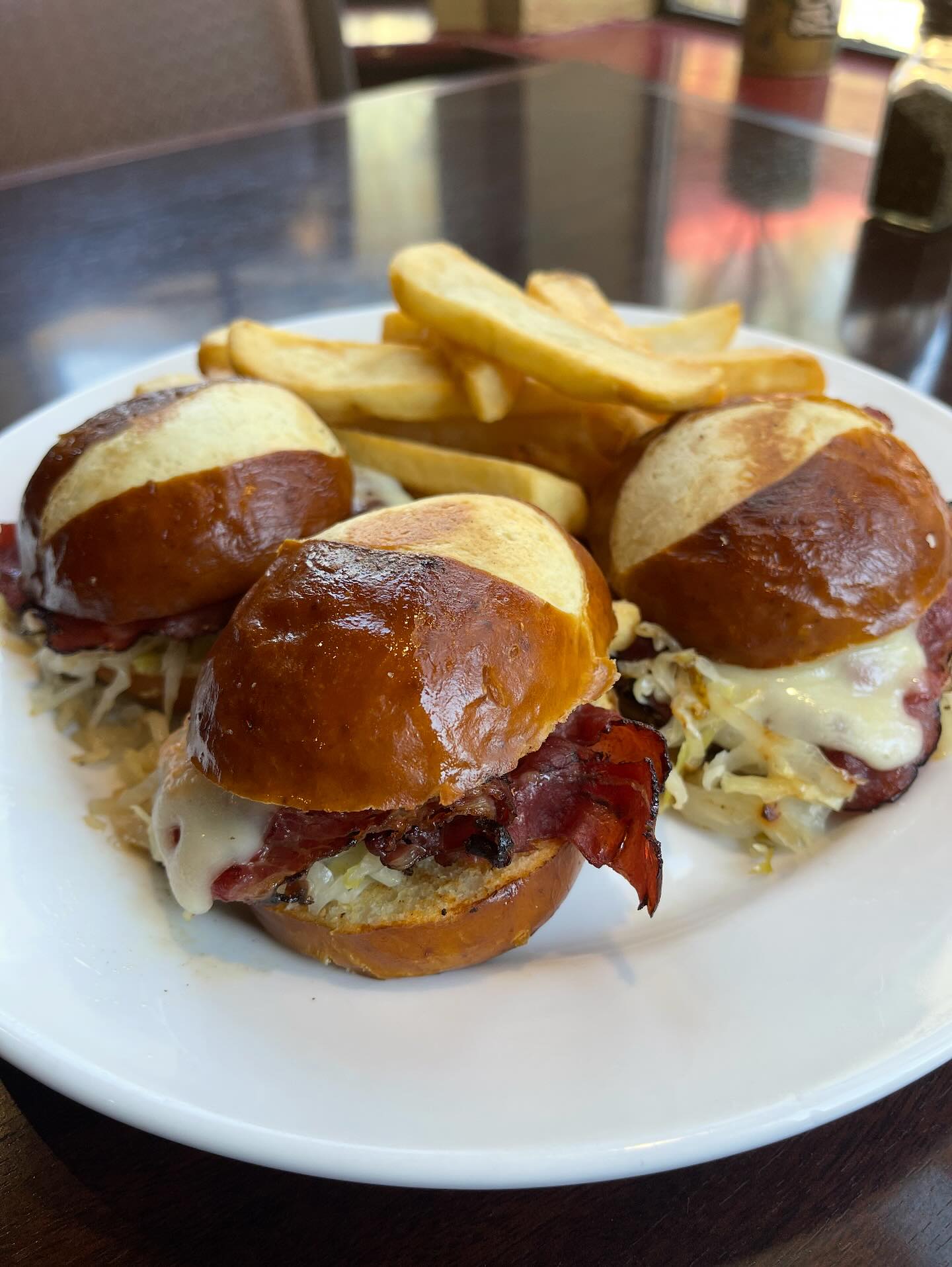 Plates of comfort food and cocktails at Dad's Kitchen